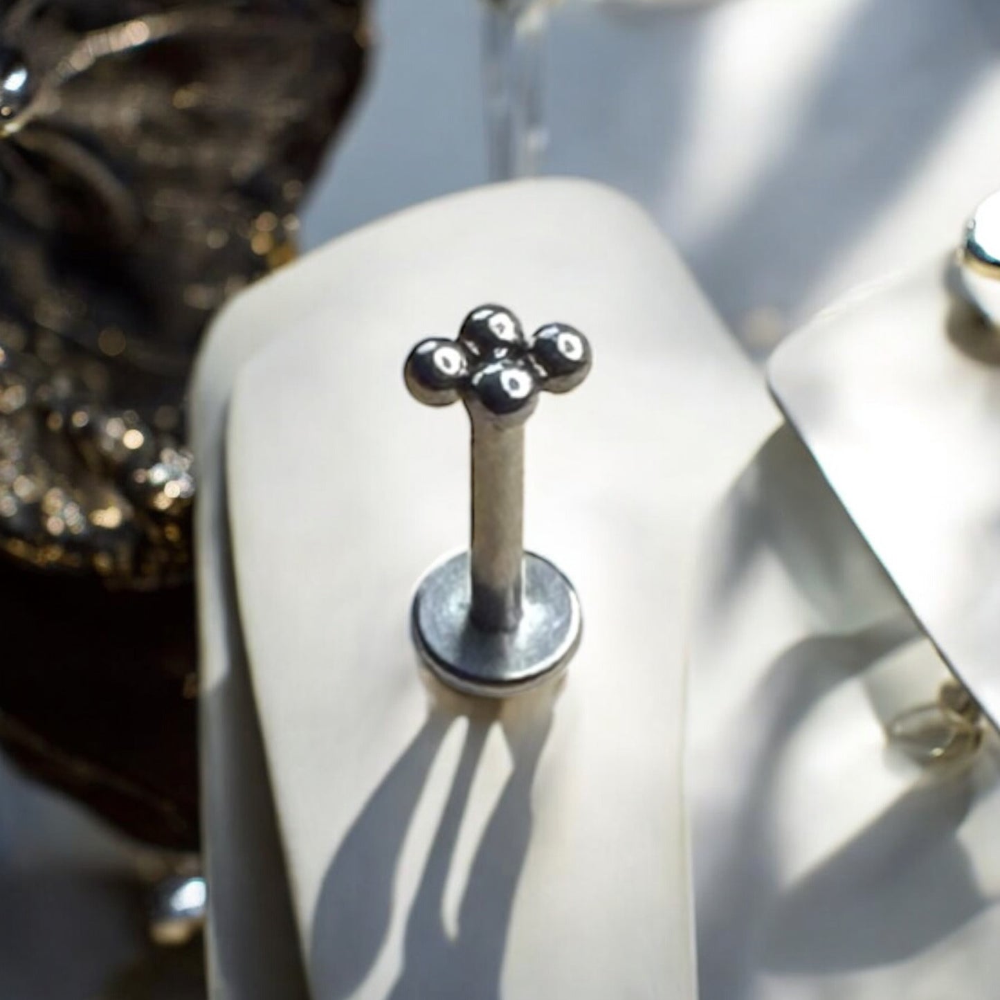Silver ornate beaded labret piercing