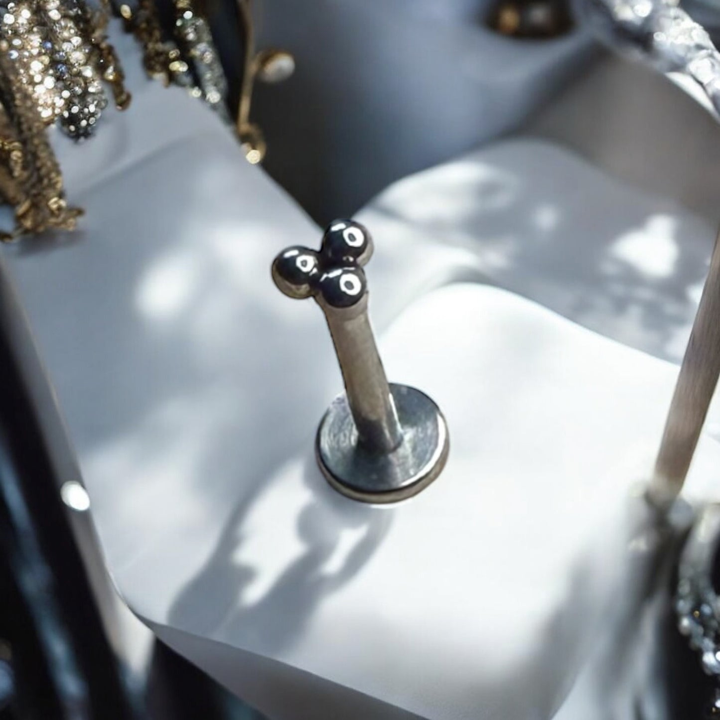 Silver ornate beaded labret piercing