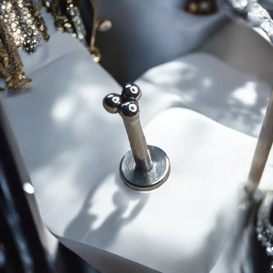 Silver ornate beaded labret piercing